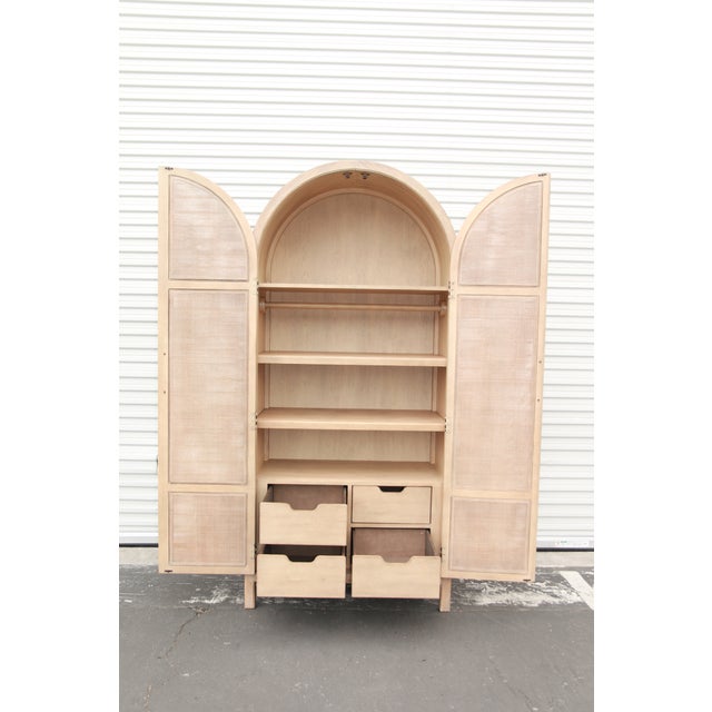 Inspired by the rugged and picturesque Malibu landscape, the Surfrider Wardrobe is crafted of Pecan Veneers and Rattan,...