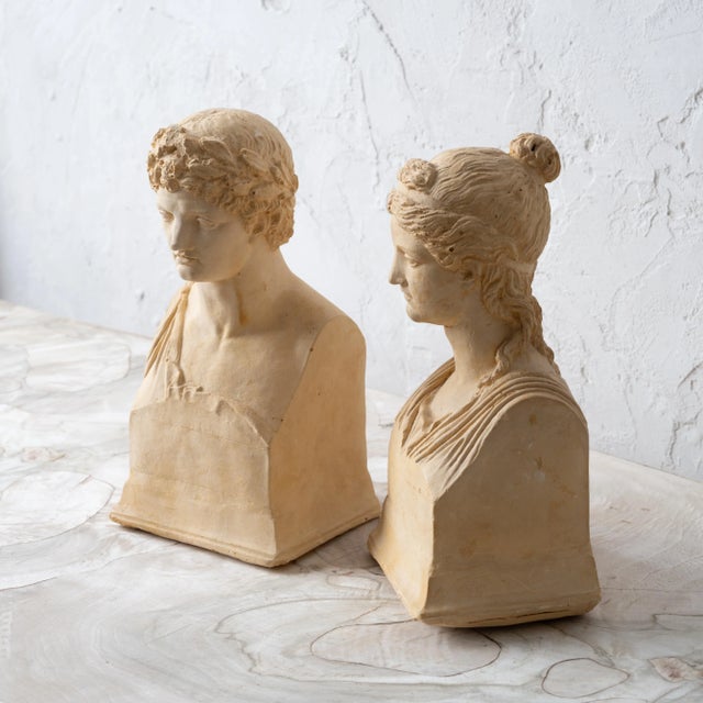 A pair of modern grand tour plaster busts depicting Apollo and Diana, circa 1940s. 5 ½ inches wide by 4 ¼ inches deep by...