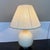Design Plus Gallery presents a Cream Crackled Table Lamp. The lamp has an ivory tone of cream with a rounded, gourd-shaped...