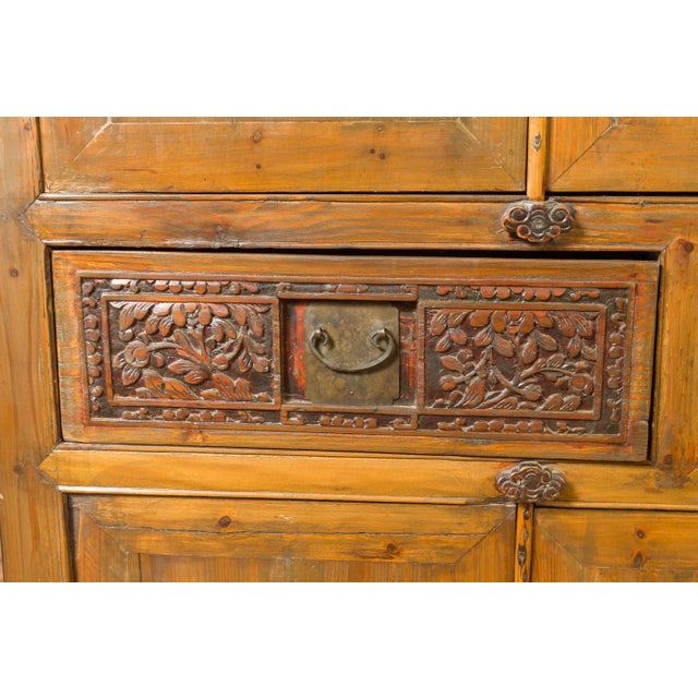 Large Chinese Qing Elm Armoire with Carved Motifs and Red Lacquered Accents For Sale - Image 4 of 13