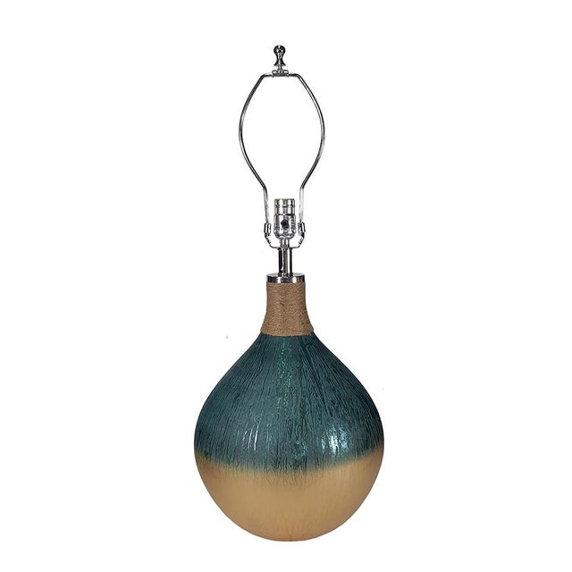 A round table lamp can add a touch of fresh, bright color to any corner of your home. This plug-in energy-saving table...