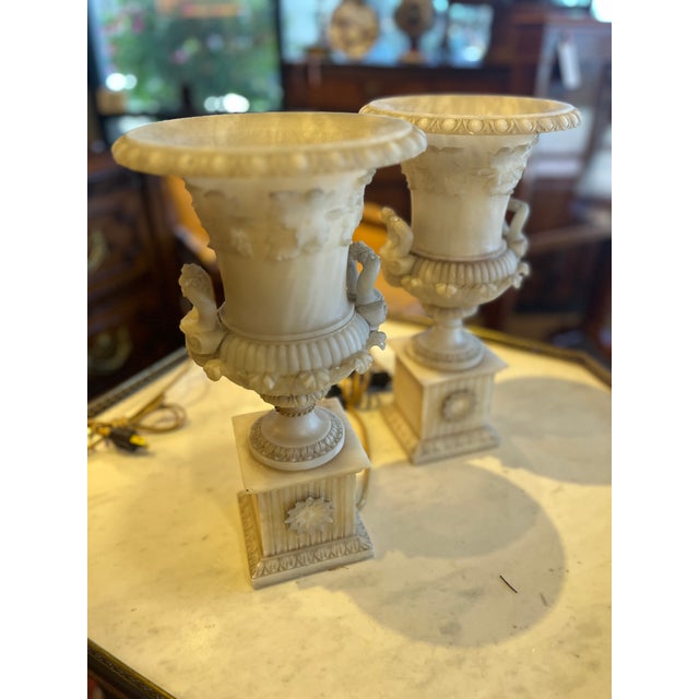 19th Century Pair French Carved Alabaster Lighted Urn Torchieres. Beautiful pair purchased in France. Age appropriate...