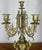 An elegant Vintage French pair of candelabras , beautifully crafted in brass and richly detailed with flowing scroll arms,...