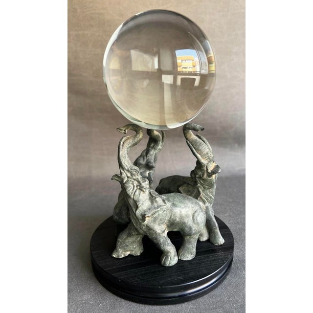 Three elephants in a circle with a crystal ball. Hollow bronze sculpture. Height: 12.5 cm (bronze) Base diameter: 11.5 cm...