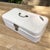 Vintage white enameled steel bread box from the 1950s, originating from the Netherlands. This charming box has a white...