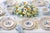 Infuse your dining experience with vibrant elegance through the Blooming Sunset Pagoda Melamine Dinner Plates. Featuring a...