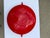 A vintage enamelware paella pan by Dansk, featuring the brand's signature Scandinavian modernist design with red handles....