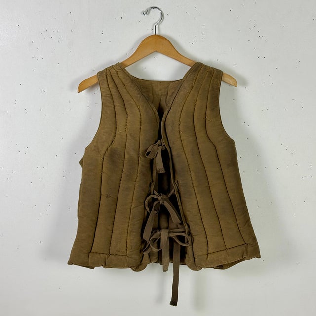 A 1940s WW2 Era Miller Kapok ‘Life Save Vest’, by The American Pad & Textile Co of Greenfield Ohio. This is filled with...