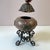 A stunning large vintage box with an ornate sculpted lid and decorative spiral leg metal base. Tagged "John Richard" on...