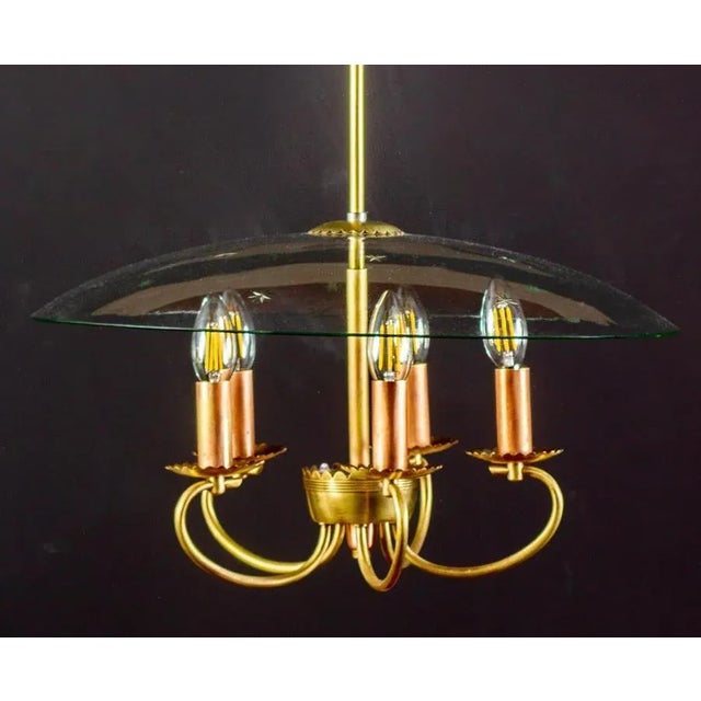 Delicious Art Deco chandelier with scrolled brass terminating in five scallop edged flower form socket cups, supported by...