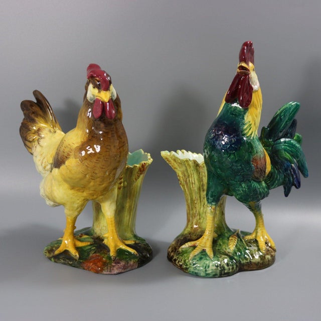 Pair of Jerome Massier French Majolica figural vases which feature a pair of chickens - a cockerel and a hen, stood in...
