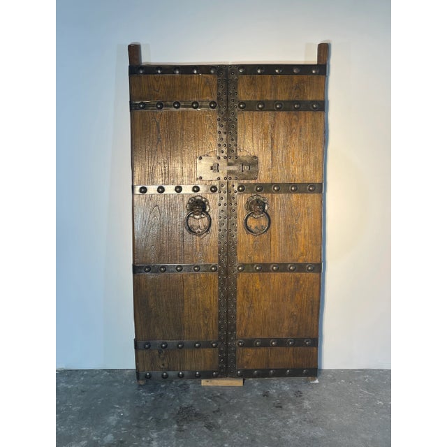 Amazing Chinese doors with foo dog knockers. Thick solid wood with iron metal work. A serous head turner ether as a lean...