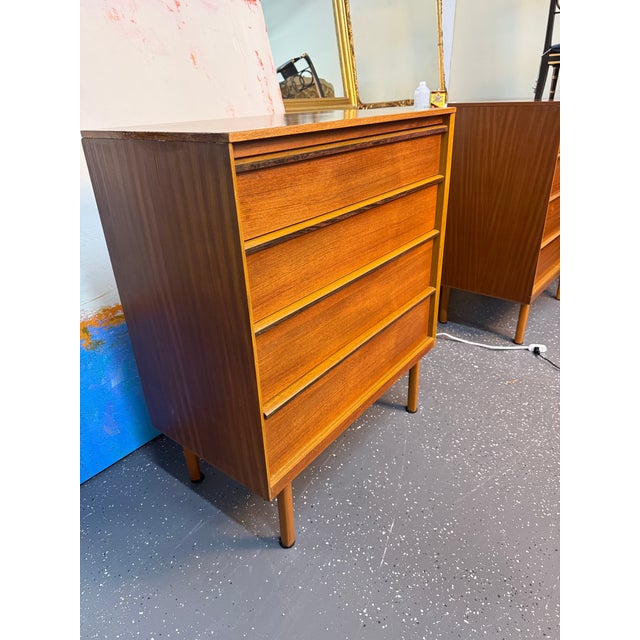 Pair of Mud-Century Modern Teak four drawer chests by Austinsuite with four graduated drawers with molded pulls ca. 1960.