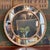 An 18th century George III giltwood circular mirror, the round center plate set within a beaded frame and ringed by a...