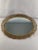A superb Oval Mirrored Vanity Tray with an ornate gold Ormolu Filigree frame made and signed by Matson. Circa 1940s....