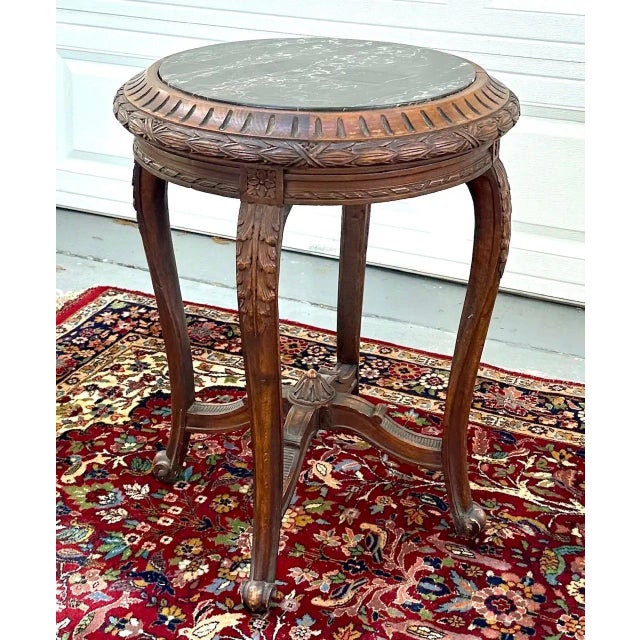 19th Century French Regence Style Round Marble Top SideTable This French 19th Century table features ornate carving and a...