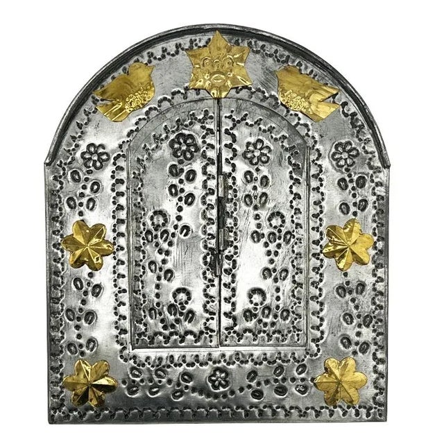 This beautifully hand-tooled Mexican tin mirror embodies the spirit of traditional folk craftsmanship found throughout...