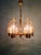 Six-arm brass chandelier with amber bubble glass globes, dating from the 1970s. Compatible with six E14 LED bulbs. Some...