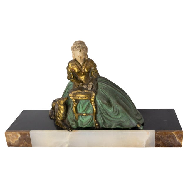 French Art Decospelter statue. Different colors of onyx and polychrome spelter circa 1930. The scene represents a woman...
