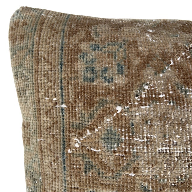 Crafted from an authentic vintage Turkish rug, this one-of-a-kind pillow brings understated elegance and timeworn...