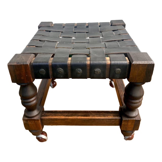 Vintage Spanish Revival Woven Leather Strap Rolling Footstool For Sale