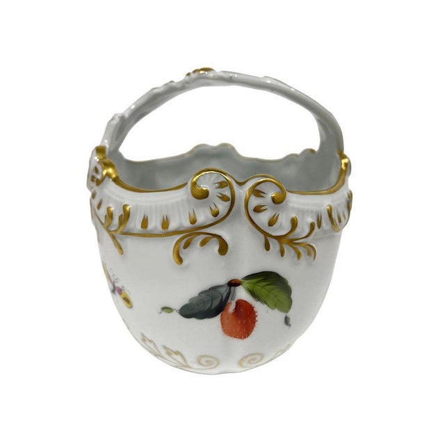 Herend Hungary porcelain basket, 1976 A Herend Hungary porcelain basket with fruit motifs, including a pear, a mushroom,...