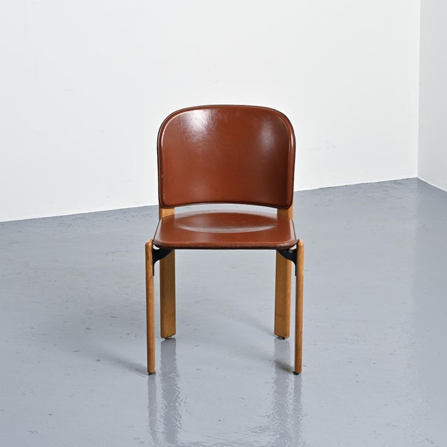Set of six chairs by Bruno Rey, a variation of the Rey Chair model. The varnished solid oak base supports a seat and back...