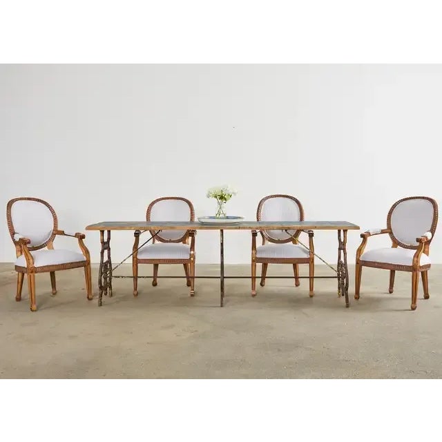 Rustic late 19th-century French industrial style bistro dining table. The 8 foot long table features a pine plank top and...