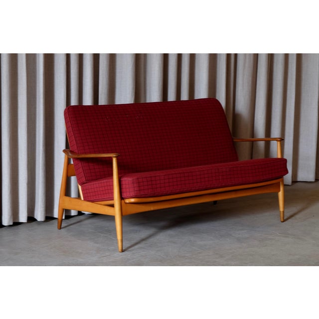 - Produced by France & Daverkosen in Denmark - Dates from the 1950s - Made of beech, teak, and fabric - It has 2...