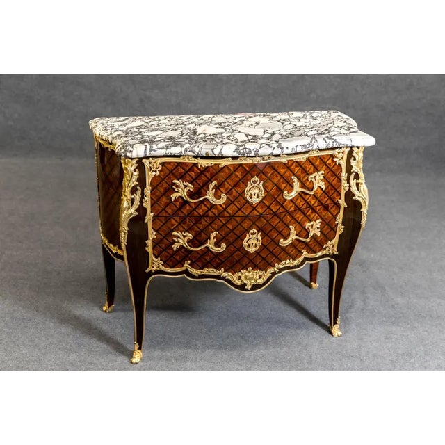 A magnificent example of 19th-century French provincial craftsmanship, this tall display cabinet (vitrine) captures the...