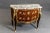 A magnificent example of 19th-century French provincial craftsmanship, this tall display cabinet (vitrine) captures the...