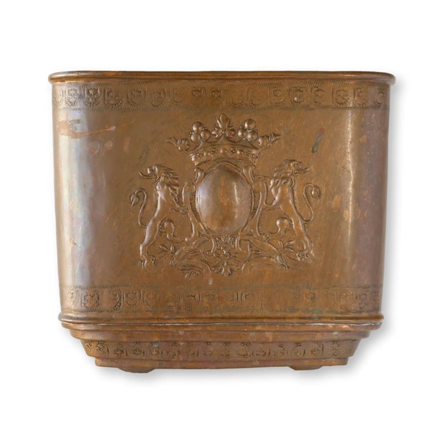 Antique French copper lavabo with embossed heraldic crest with lions and crown. The two-piece form includes the reservoir...