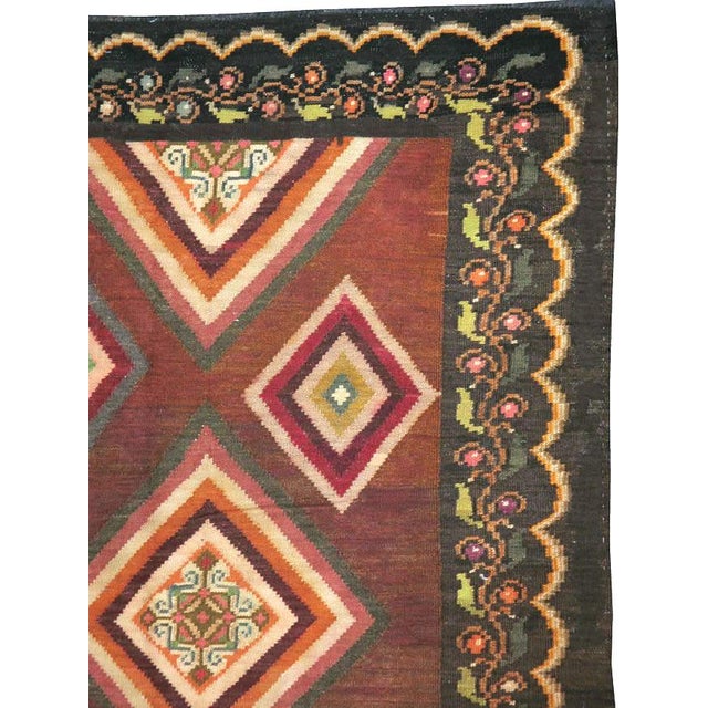 A vintage Turkish flat-woven Kilim carpet from the mid-20th century.