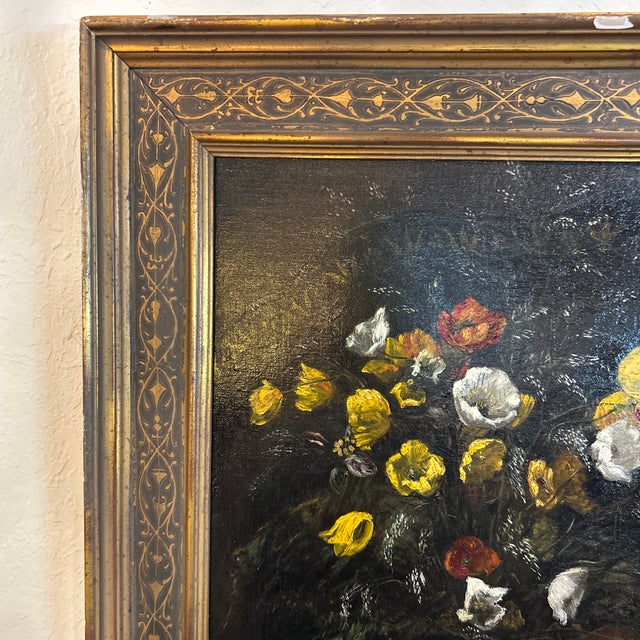 Striking antique oil painting on canvas of flowers in a vase, signed Mabel.B Messer and presented in the original wood frame.