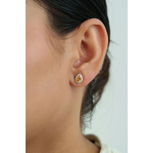 These pear shape stud earrings feature 1 carat of pear-cut yellow sapphires set in 14k white gold. Each sapphire measuring...