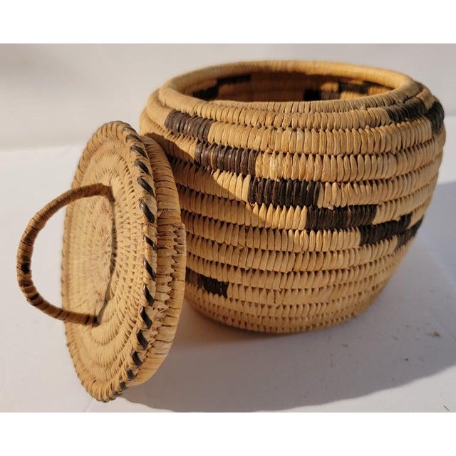 20th C Small Hand woven Lidded Basket with Handle. Great condition.