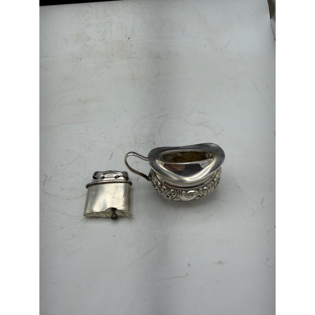 Lovely and unique silverplate table lighter. The vintage 1950's Mosada period series lighter was crafted in England....
