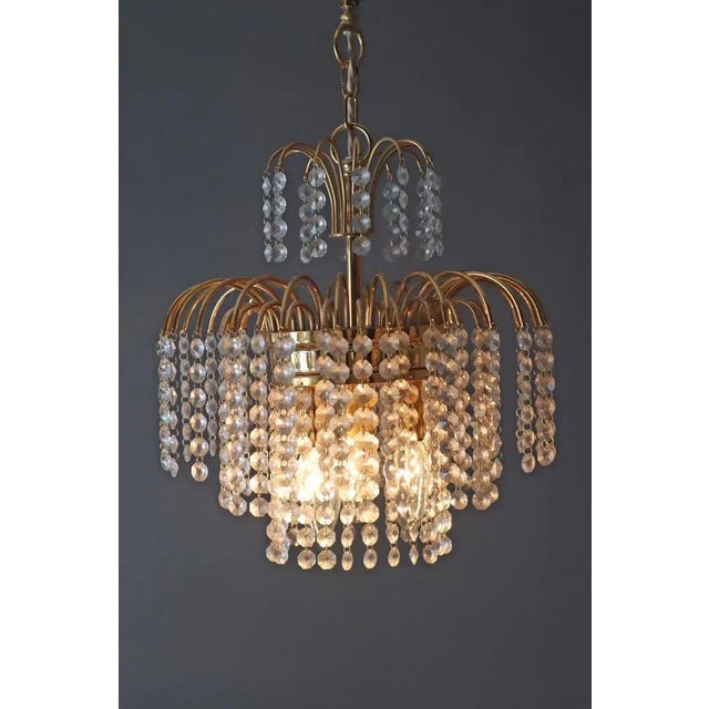 Hollywood Regency Crystal Waterfall Chandelier from Sölken Leuchten, 1970s, in Very Good conditions. Designed 1970 to 1979...