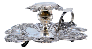 Silver Paddle with Raised Floral Motifs and Resting on Three Feet