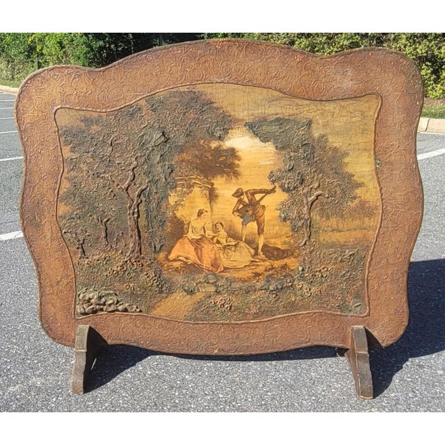 A gorgeous hand painted fireplace screen. Actual raised hand painting on solid wood. The painting depicts two ladies in...