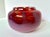 This luminous hand-blown art glass vase captivates with its rich ruby hues and seamless ombré into soft milky rose. The...