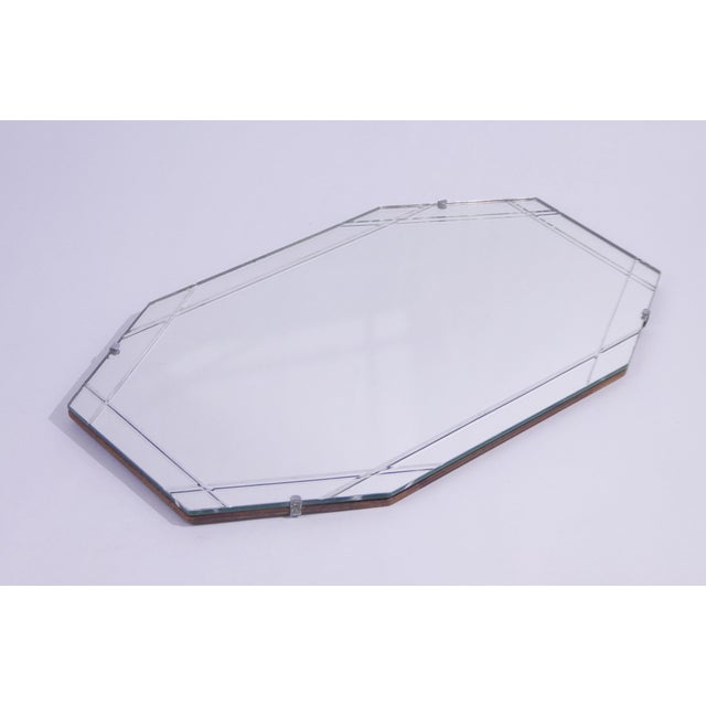 Antique Art Deco style frameless mirror in an octagonal shape. The wall mirror has lines which make it very unique....