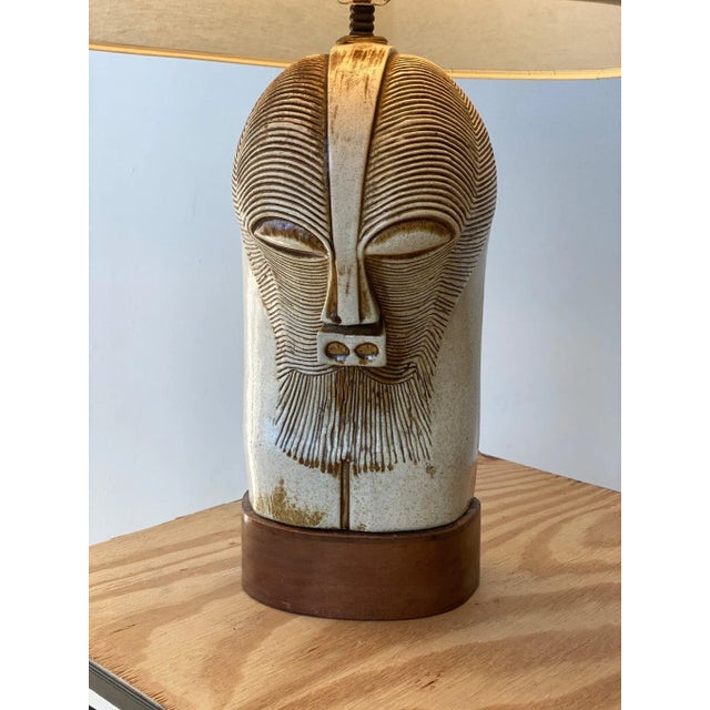 Vintage Large Scale Ceramic Kifwebe-Inspired Mask Lamp on Mahogany Base, Circa 1950s. A gorgeous interpretation of a...