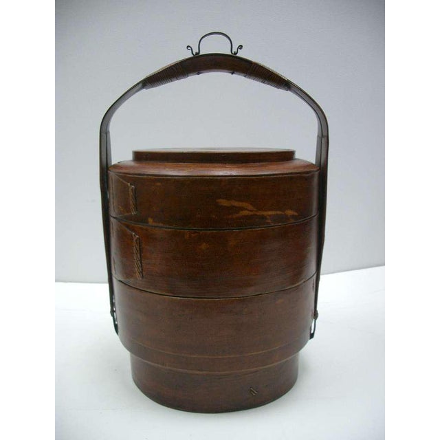 Wonderful 19th century food caddy basket with two compartments that are also used to serve. Turned woven bamboo with reed...