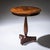Side table with circular top and trefoil base. The table stands on a baluster-shaped column decorated with brass moldings...