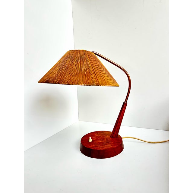 Beautiful mid-century table lamp made by the German-Swiss manufacturer Temde Leuchten in the 1960s. Model 33 features the...