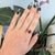 A 4.42-carat Madagascar ruby glows in a deep, warm red at the center of this solid 14K yellow gold estate ring, accented...