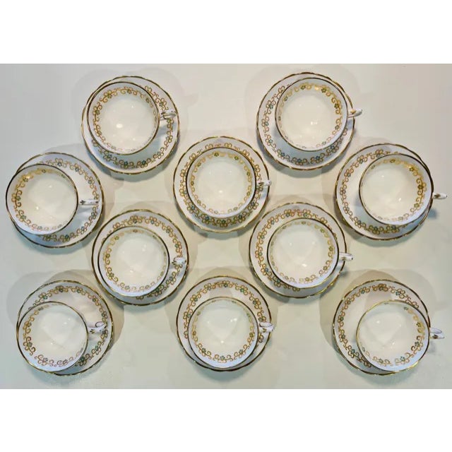 Exquisite set of 10 antique Tiffany & Co. cups and saucers. Delicately adorned with hand painted turquoise florets and...