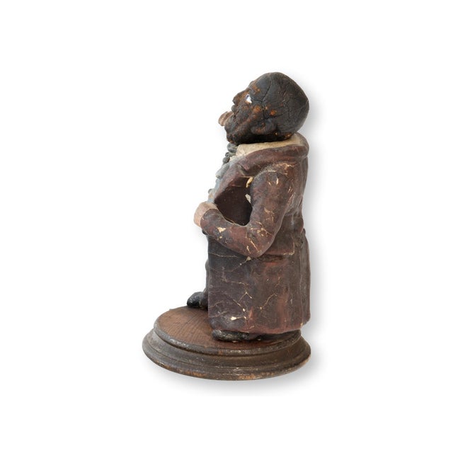 Mid-19th century papier-mâché folk art figure, likely Mr. Pickwick from Charles Dickens' The Pickwick Papers. With his...