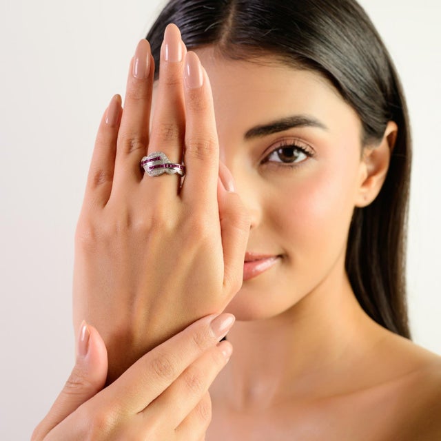 This elegant Ruby & Diamond Band Ring is beautifully crafted in premium 925 sterling silver, showcasing a modern...